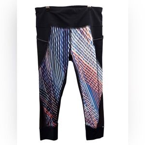 Athleta Capri Blue Leggings with black accents and geometric pattern. EUC